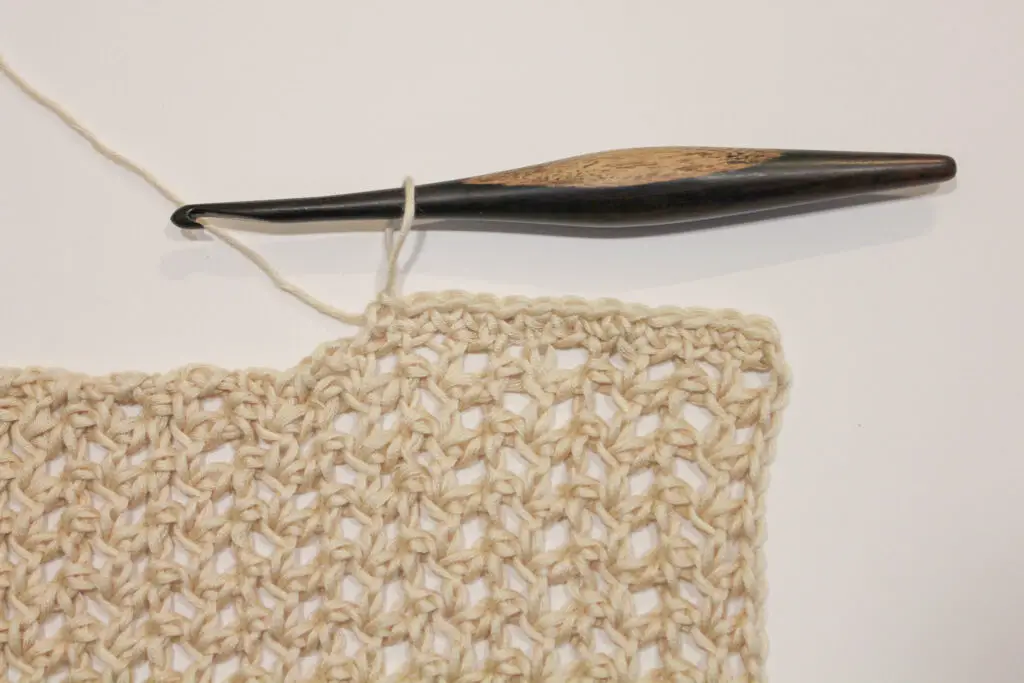 Single crochet evenly down the sides of the rows.