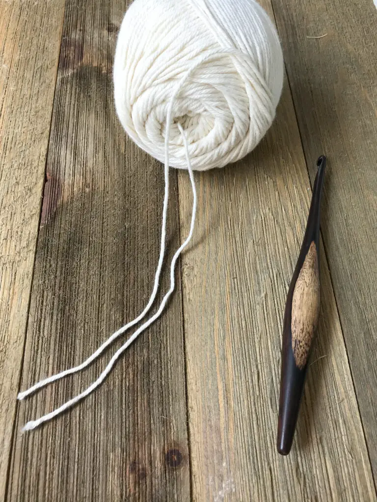 Using two strands of yarn from the same skein.