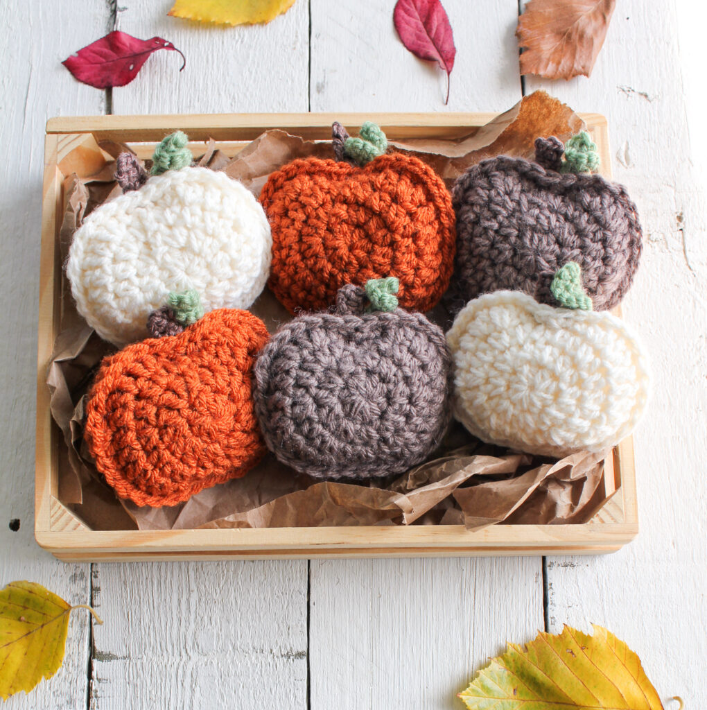 pumpkins in a fall basket