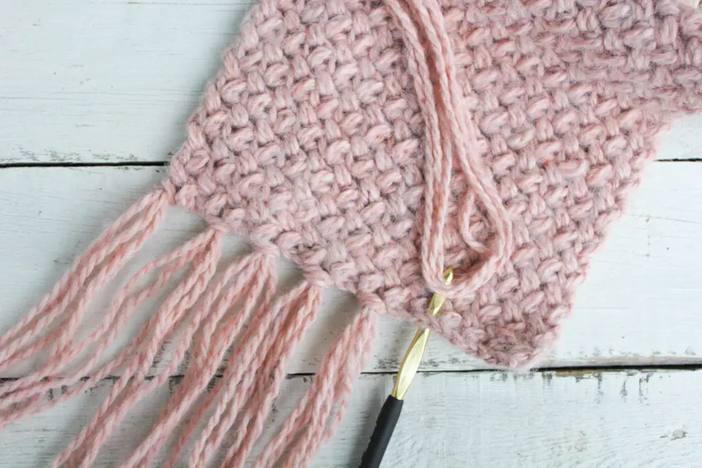 Use crochet hook to attach fringe