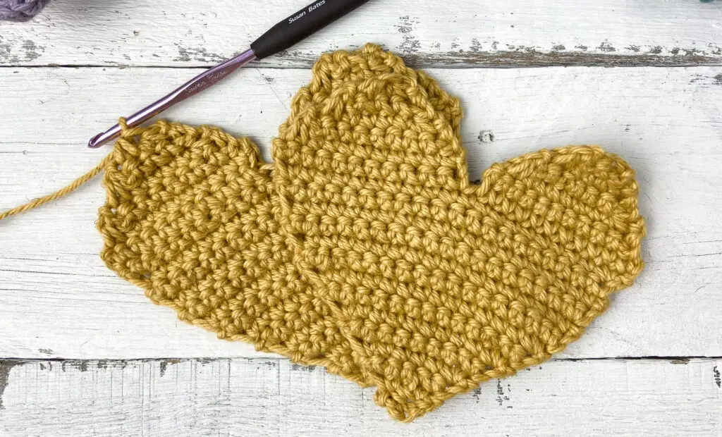 two crochet hearts panels ready for assembly