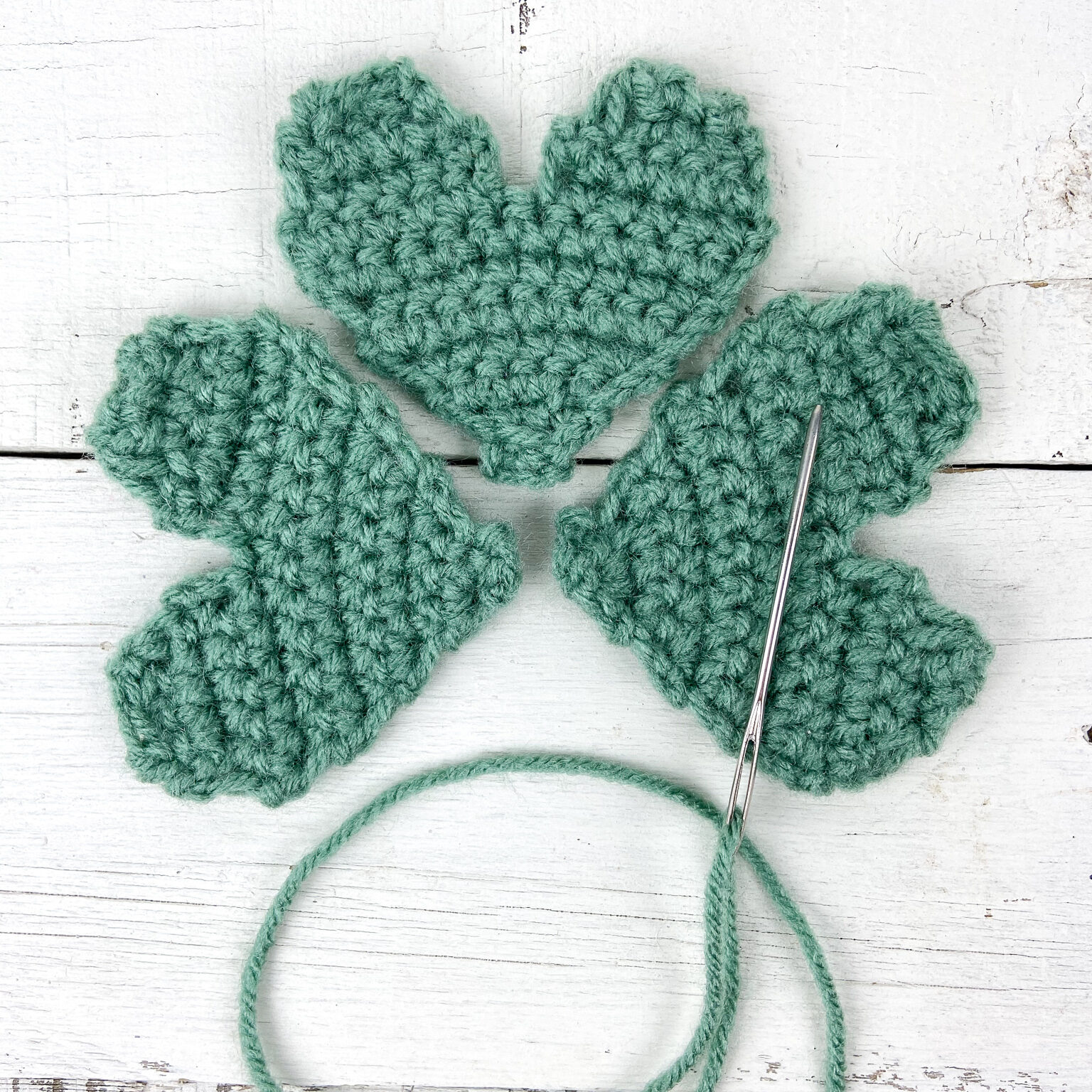 Align the hearts in a shamrock shape