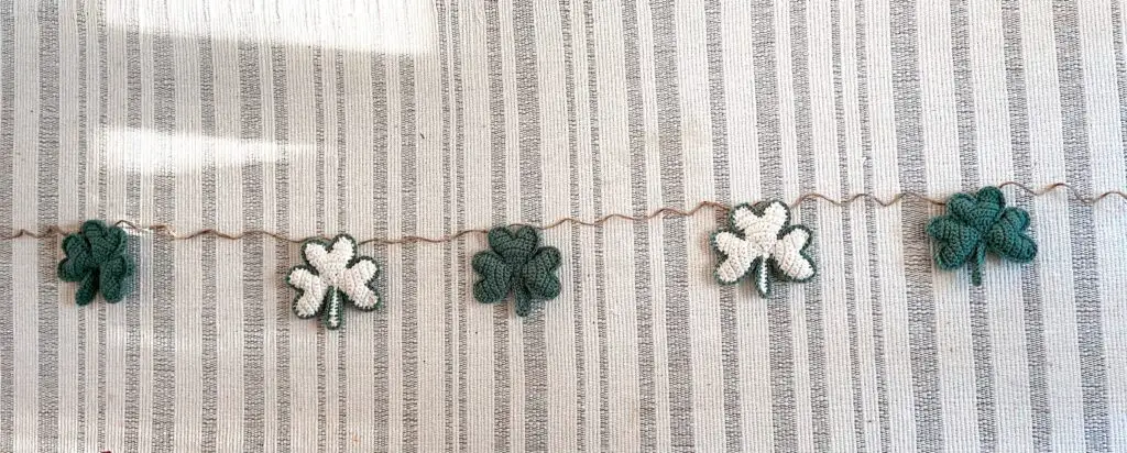 Arrange shamrocks on garland